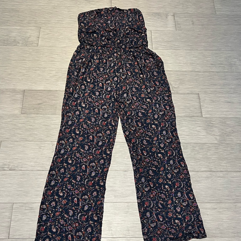 Navy blue paisley print wide leg pants with elastic waist and pockets.